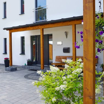 Haus Betten - Einfamilienholzhaus mit weißer Putzfassade