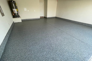 Mid-sized attached two-car garage photo in Dallas
