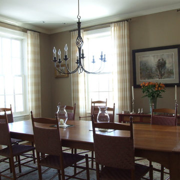 Dining room full length draperies with inverted pinch pleats on poles with rings