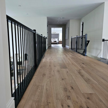 Project #130 | Curved Staircase with Wraparound Balcony