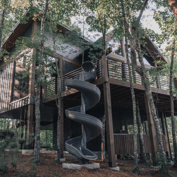 Elevated Treehouse Exterior with Spiral Slide