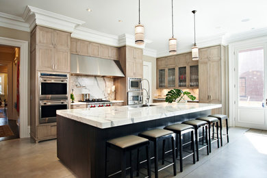Open concept kitchen - large transitional l-shaped cement tile floor and green floor open concept kitchen idea in Toronto with a farmhouse sink, shaker cabinets, medium tone wood cabinets, marble countertops, white backsplash, marble backsplash, stainless steel appliances, an island and white countertops