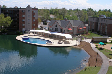 Example of a large courtyard custom-shaped pool design in Denver