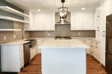 Kitchen - large country kitchen idea in Dallas with a farmhouse sink, white cabinets, quartzite countertops, gray backsplash, ceramic backsplash, stainless steel appliances and white countertops