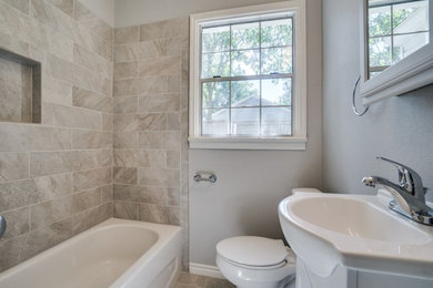 Small transitional 3/4 bathroom in Dallas with an alcove tub, a shower/bathtub combo, a two-piece toilet, beige tile, porcelain tile, grey walls, travertine floors, a drop-in sink, solid surface benchtops, beige floor and a shower curtain.