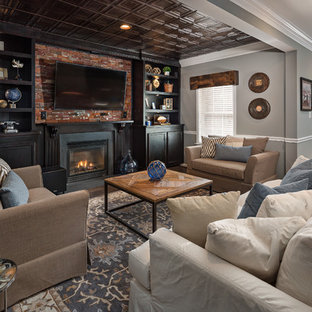 Traditional walk-out basement in DC Metro with grey walls, carpet, a standard fireplace and multi-coloured floors.