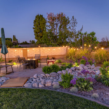 Backyard Patio with Spacious Lawn & Dry Stream Bed