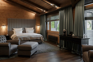 This is an example of a transitional master bedroom in Moscow with brown walls, medium hardwood floors and brown floor.
