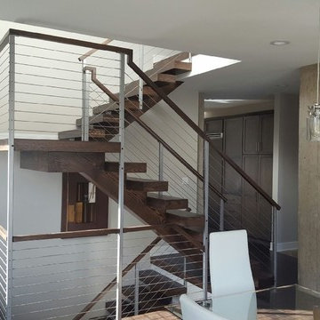 Open riser stairs with stainless steel cable wire railing