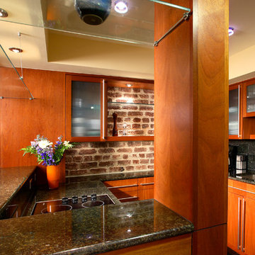 Mahogany, Glass and Granite finishes complement modern efficiency in the Kitchen