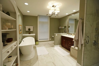 Example of a mid-sized transitional master porcelain tile bathroom design in San Diego with raised-panel cabinets, dark wood cabinets, a one-piece toilet, green walls and an integrated sink