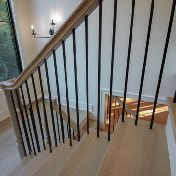 Project #93 | Captivating Staircase with Light Wood and Black Spindles