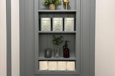 Example of a farmhouse powder room design in Toronto