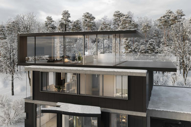Mittelgroßes, Dreistöckiges Modernes Einfamilienhaus mit Betonfassade, grauer Fassadenfarbe, Flachdach und schwarzem Dach