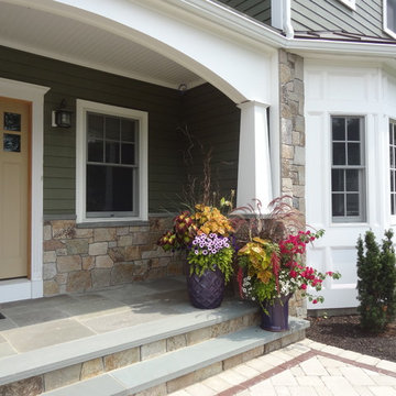 Combining Colonial Tan Natural Stone with Olive Green Siding