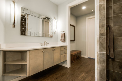 Design ideas for a large contemporary master bathroom in Dallas with flat-panel cabinets, grey walls, dark hardwood floors, an undermount sink, quartzite benchtops and brown floor.