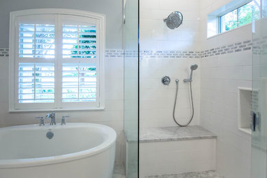 Inspiration for a large transitional master marble floor bathroom remodel in Jacksonville with recessed-panel cabinets, white cabinets, a two-piece toilet, an undermount sink, marble countertops and a hinged shower door