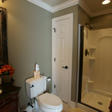 Bathroom With Dark Wood and Oil Rubbed Hardware