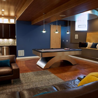 Design ideas for a contemporary look-out basement in Chicago with concrete flooring and blue walls.