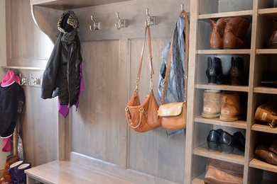 Inspiration for a small country ceramic tile and brown floor entryway remodel in DC Metro with gray walls and a light wood front door
