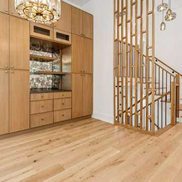 Custom Cabinetry with Vertical Screen Staircase & Statement Lighting