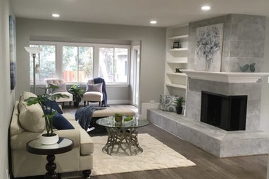 Small minimalist formal and open concept living room photo in Sacramento with gray walls and a tile fireplace