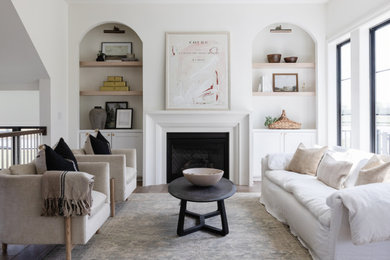 Inspiration for a transitional living room remodel in Omaha with white walls and a standard fireplace