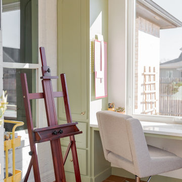 Arched Built-Ins Meet Terracotta Tile in a Light-Filled Sunroom Addition