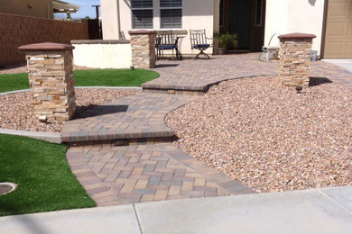 This is an example of a drought-tolerant front yard concrete paver walkway in Los Angeles.