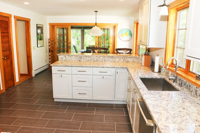 Inspiration for a contemporary kitchen remodel in Boston with a drop-in sink, gray cabinets, marble countertops, white backsplash and stainless steel appliances