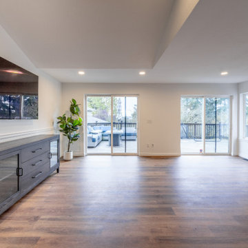 Modern Great Room with Vaulted Ceilings and Custom Wall Molding