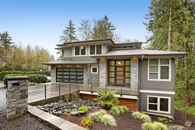 Example of a trendy mixed siding exterior home design in Portland