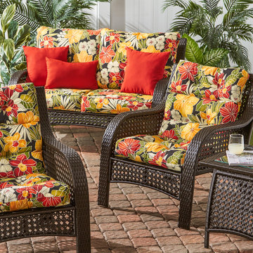 Wicker Woven Lounge Set with Vibrant Reds and Tropical Floral Cushions