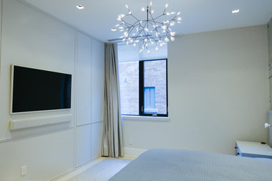 Example of a transitional master bedroom design in Toronto