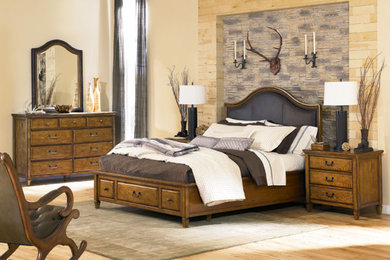 Bedroom - rustic master light wood floor bedroom idea in Cincinnati with beige walls
