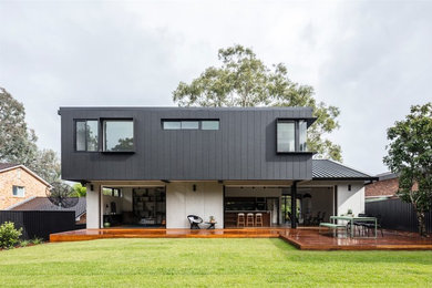 This is an example of a modern house exterior in Other with a flat roof.