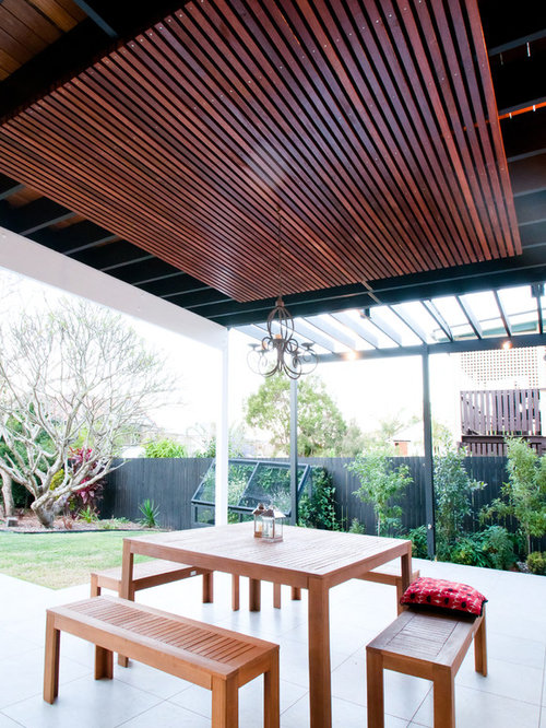 75 Patio with a Roof Extension and Concrete Slab Design Ideas Stylish