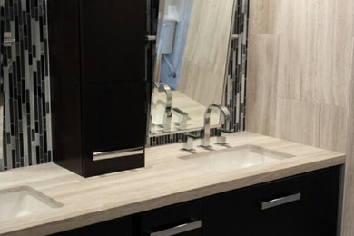 Minimalist ceramic tile walk-in shower photo in Los Angeles with an undermount sink, dark wood cabinets and gray walls