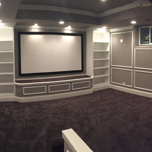 Design ideas for a medium sized classic enclosed home cinema in Chicago with grey walls, ceramic flooring, a projector screen and grey floors.