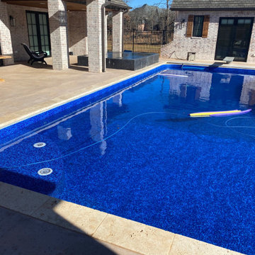 Polymer vinyl liner pool w/concrete spillover spa & automatic pool cover