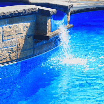 Natural Stone Water Feature with Spill Over Spa and Flagstone patio