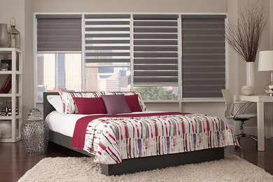 Example of a minimalist guest dark wood floor bedroom design in Indianapolis with gray walls