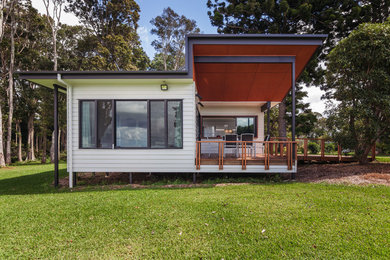 Small trendy white one-story wood exterior home photo in Brisbane
