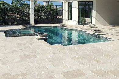 Beach style pool photo in Tampa
