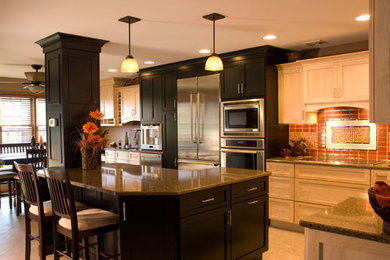 Large trendy u-shaped porcelain tile and beige floor eat-in kitchen photo in Philadelphia with an undermount sink, shaker cabinets, dark wood cabinets, quartz countertops, glass tile backsplash, stainless steel appliances, an island and red backsplash