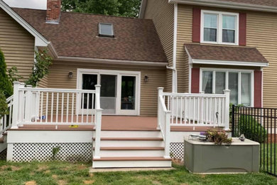 Example of a mid-sized backyard deck design in Boston