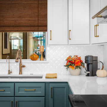 Kitchen view highlighting the sink area with teal cabinetry