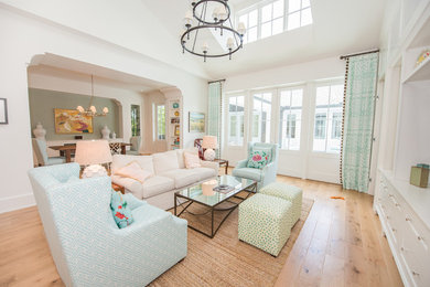 Inspiration for a large transitional open concept light wood floor and brown floor family room remodel in Orlando with white walls, no fireplace and no tv