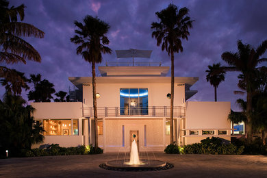 Large trendy two-story exterior home photo in Miami