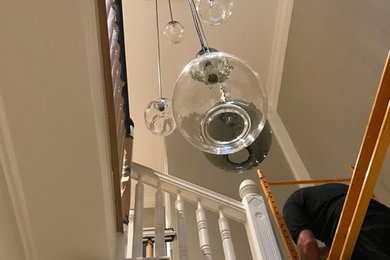 Inspiration for a large contemporary painted u-shaped wood railing staircase remodel in San Francisco with painted risers